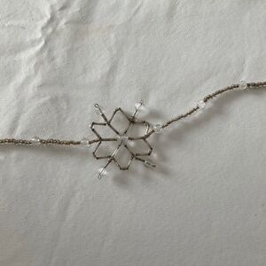 8 1/2 ft silver, plastic, and glass garland